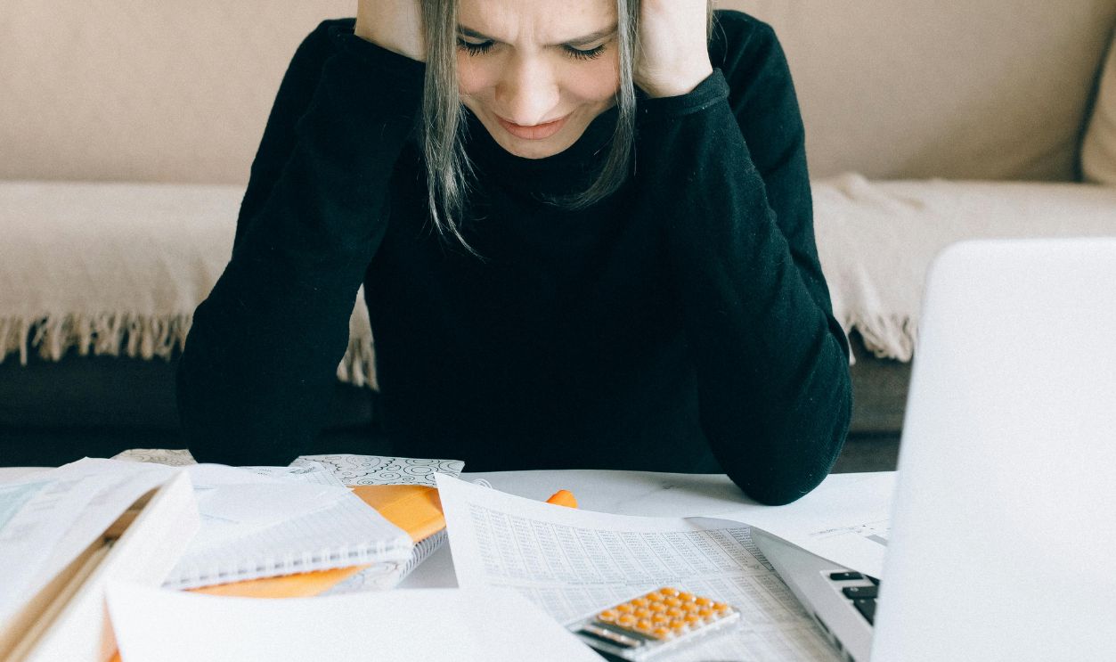 Exhausted Woman Holding Her Head