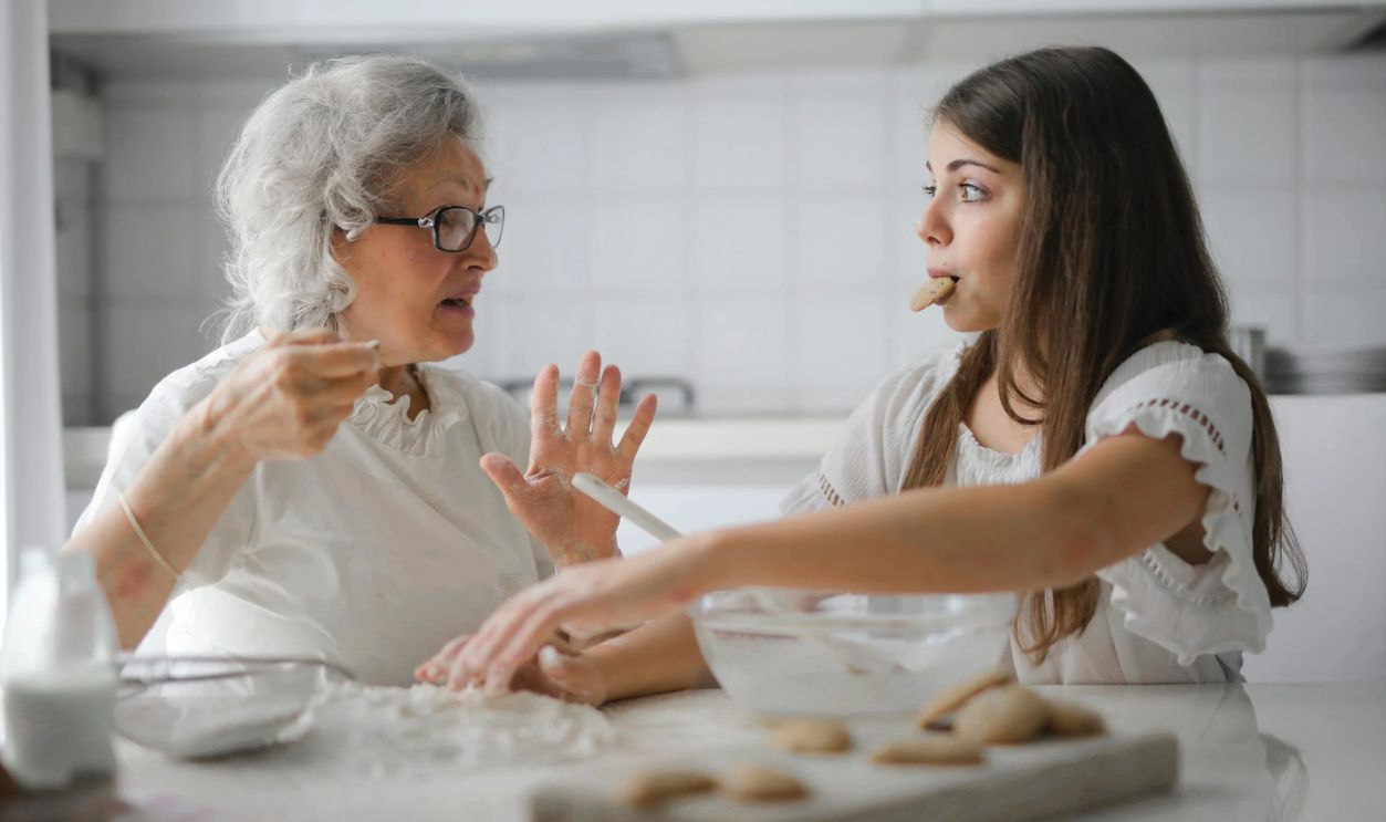 Pensive grandmother with granddaughter