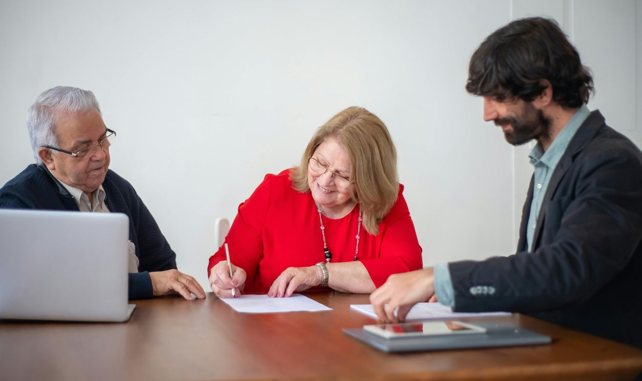 Woman signing a document-