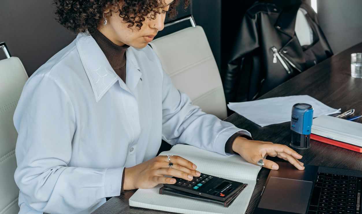 An accountant using a calculator