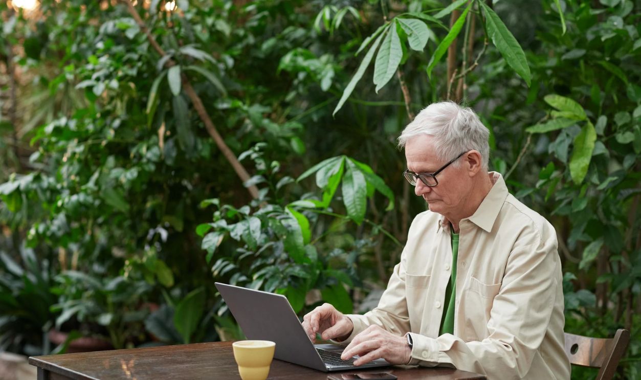 Man Busy Using His Laptop