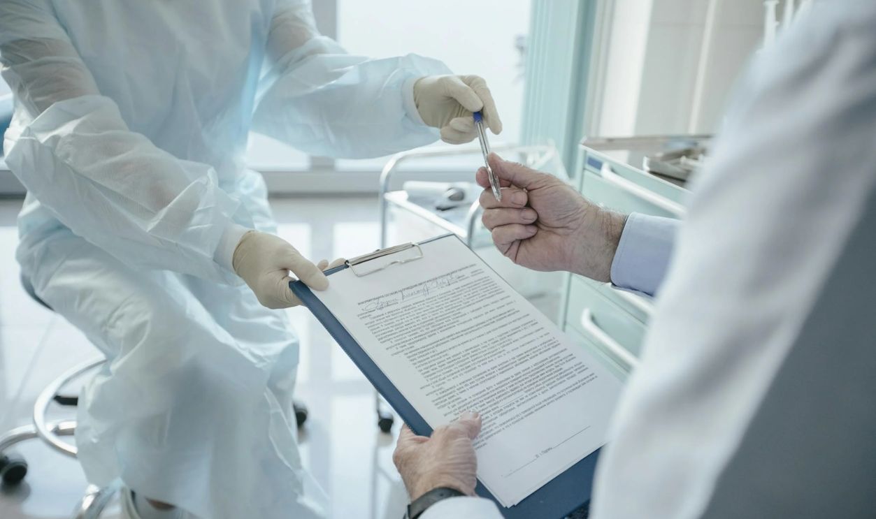 Doctor handing a Document