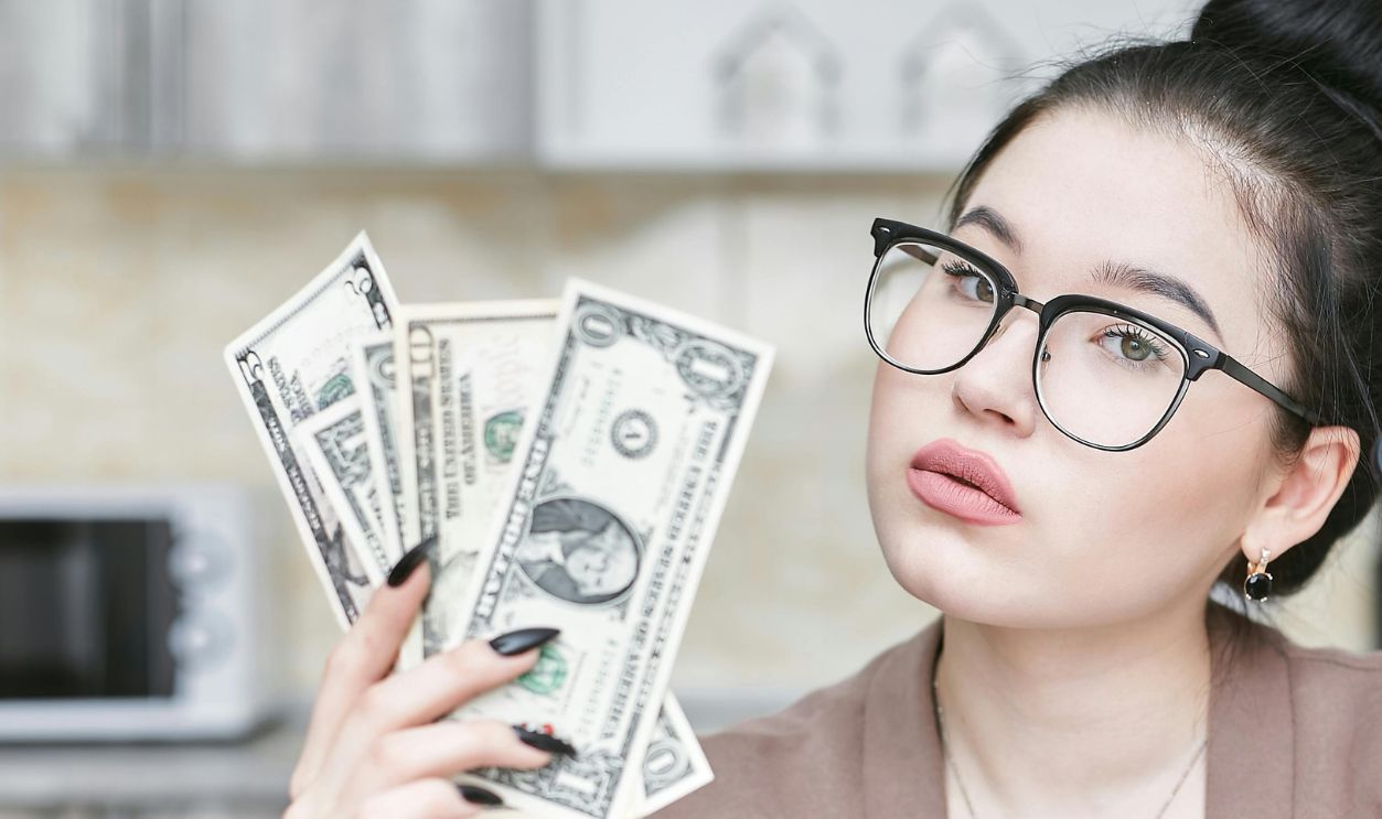 A woman holding money