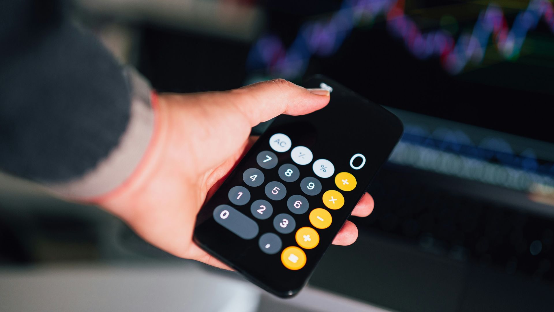 a person holding a remote control in their hand