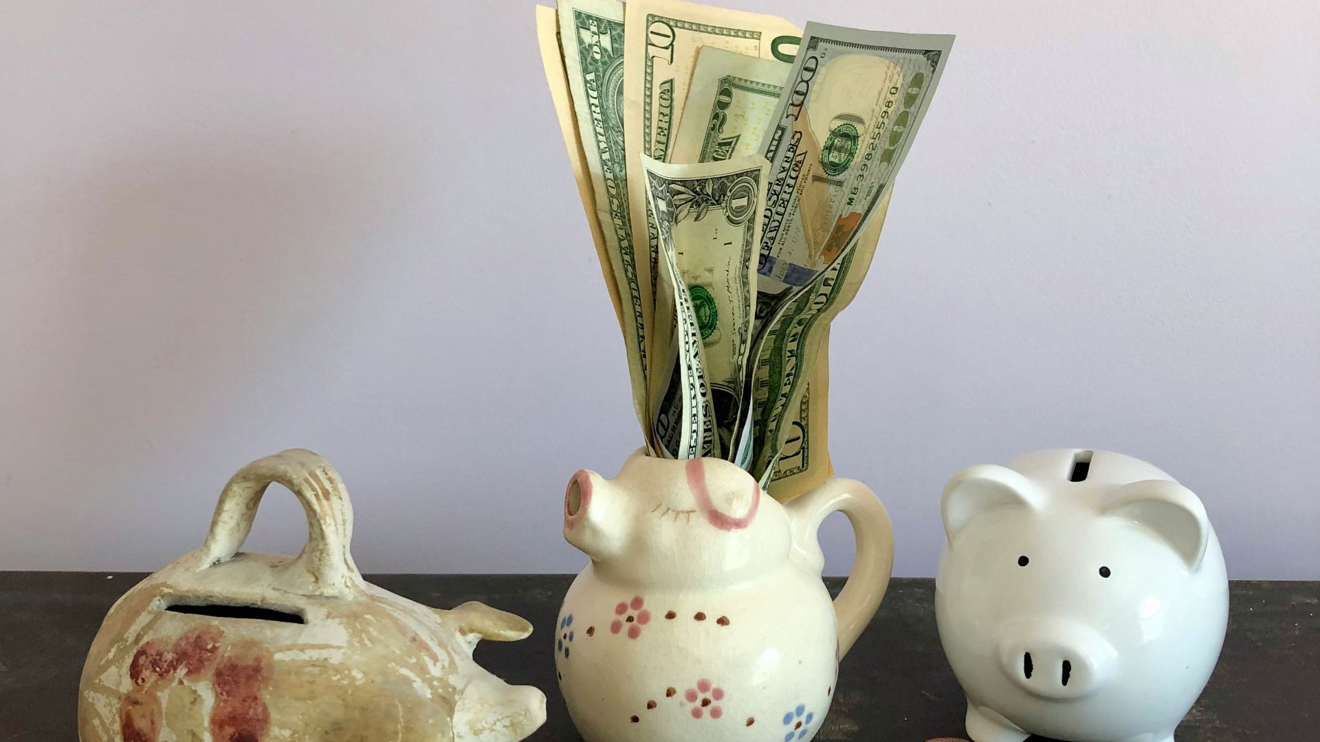 white ceramic teapot beside white ceramic teapot