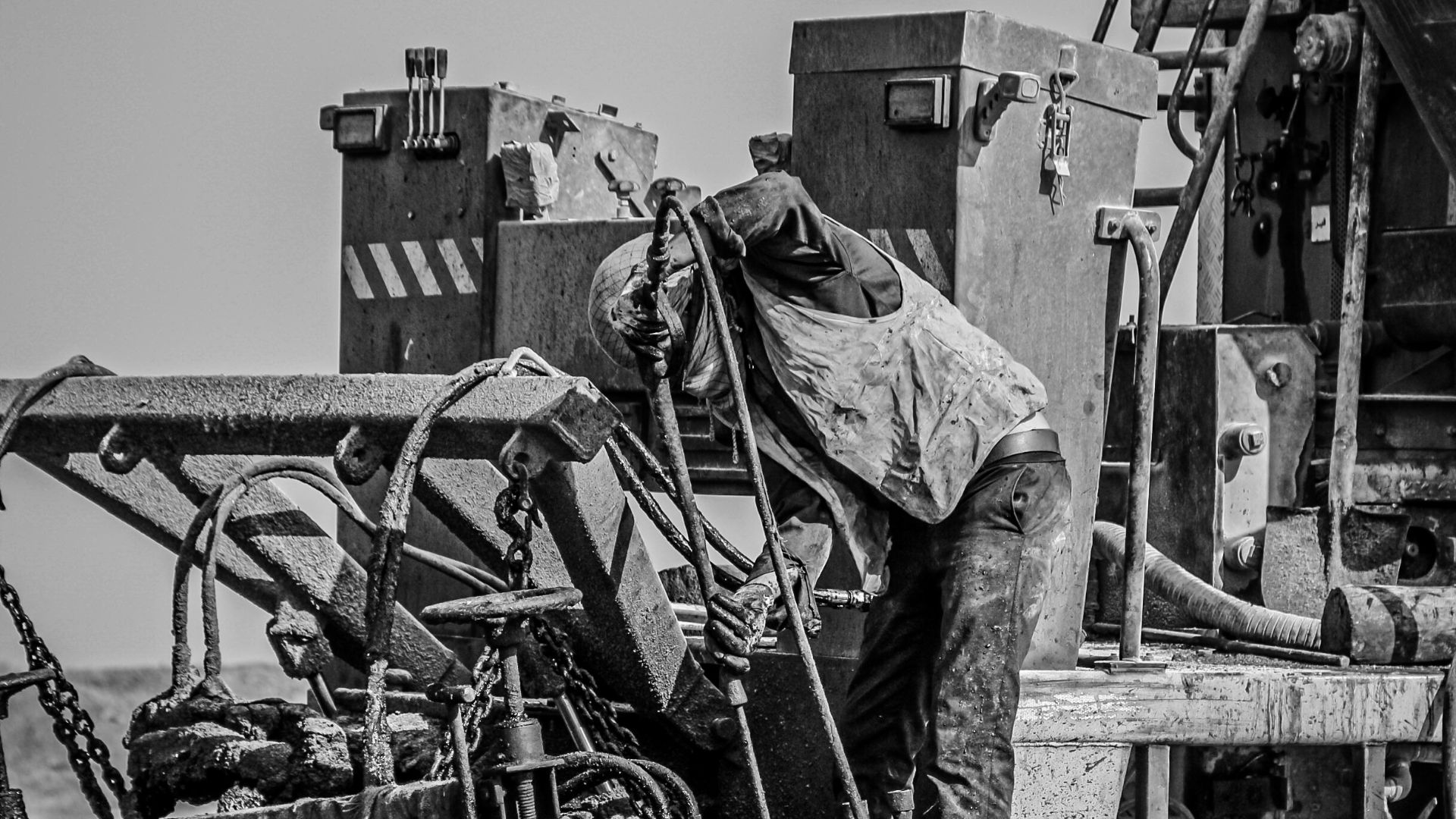 a black and white photo of a large truck