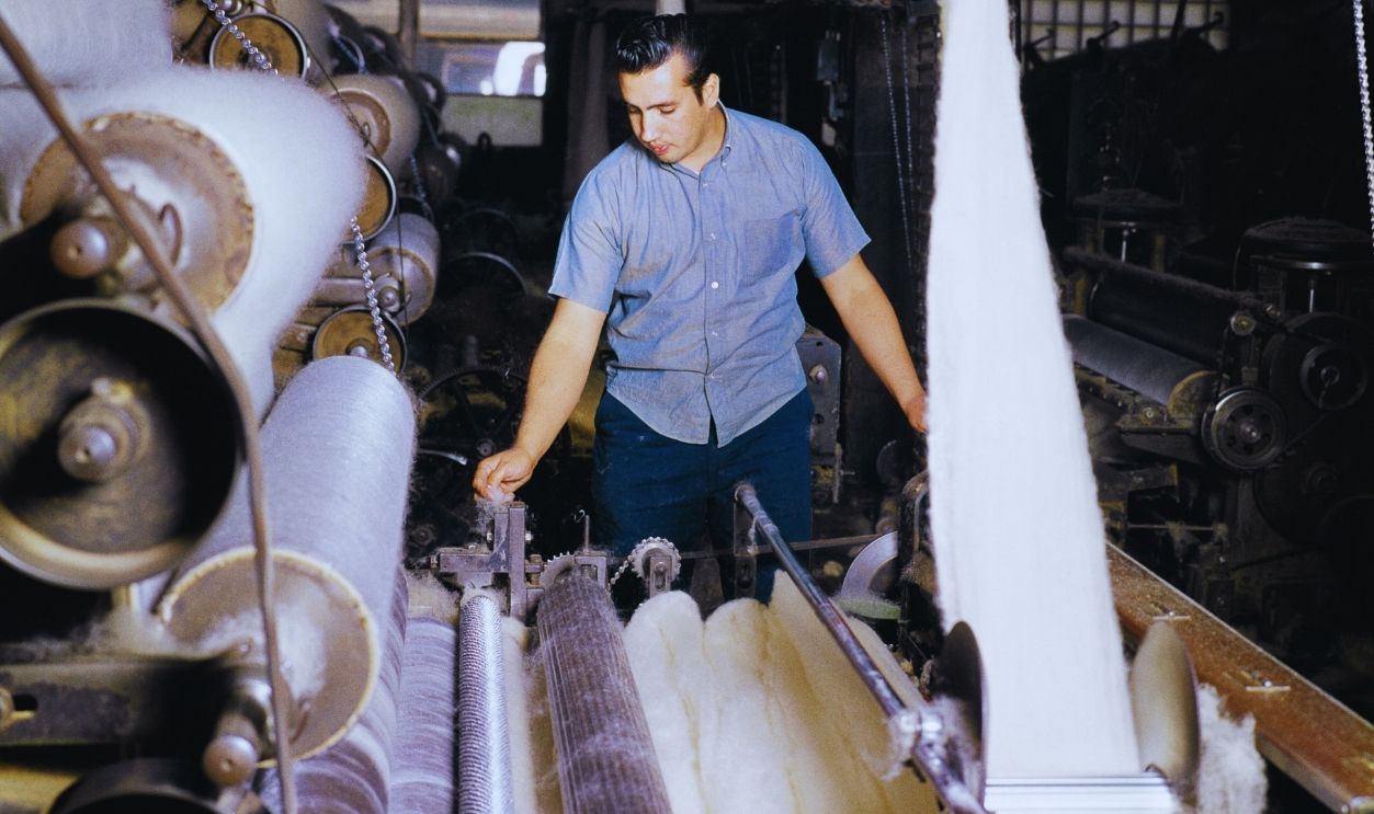 Gettyimages - 1298273241, 1960s Textile Worker 1960s Textile Man Working Watching Operating Wool Carding Machine In Woolen Mill. 