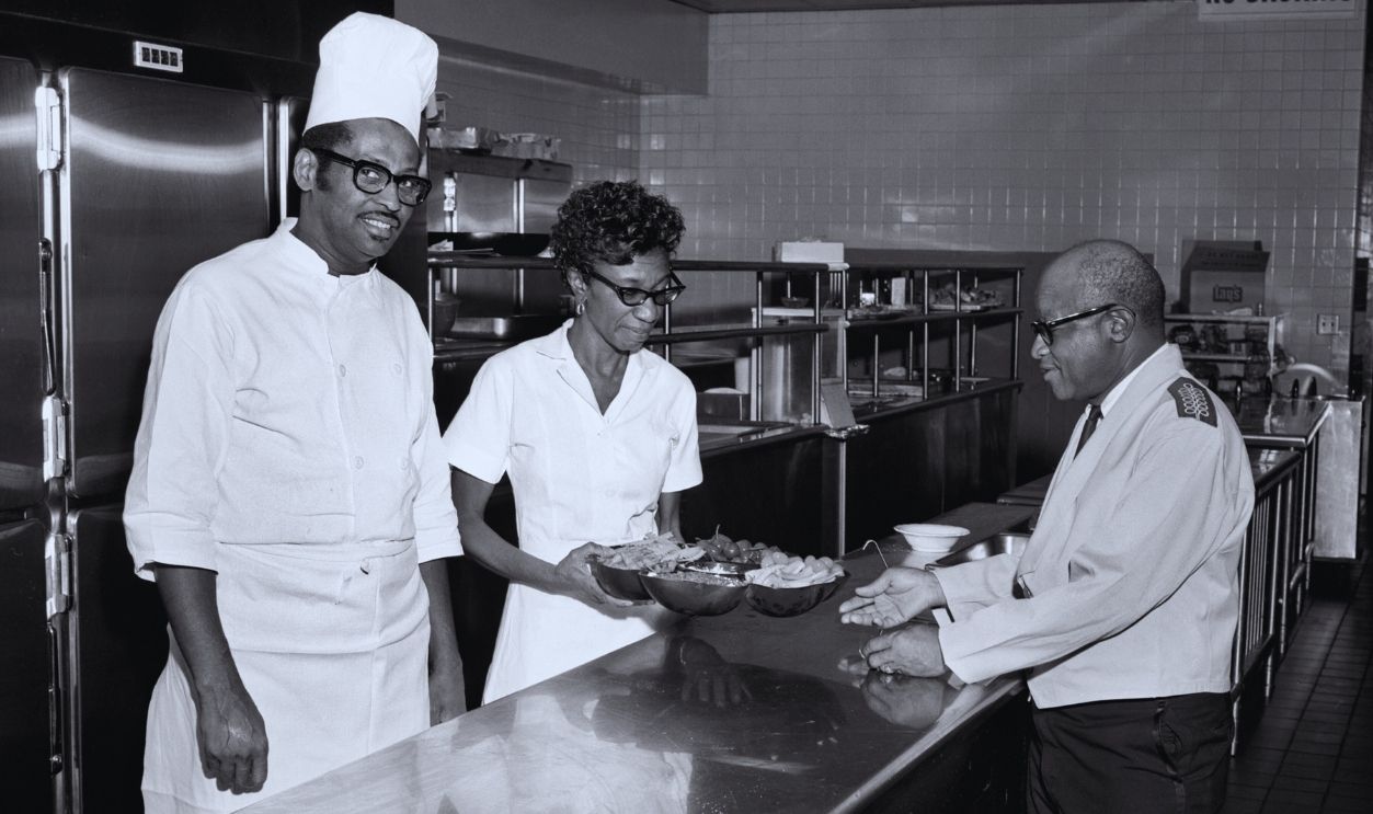 Gettyimages - 2186417914, Belle Meade Country Club Employees In Nashville Tennessee A group of African American kitchen workers and waitstaff prepare for guests at the Belle Meade Country Club in 1971 in Nashville, Tennessee.