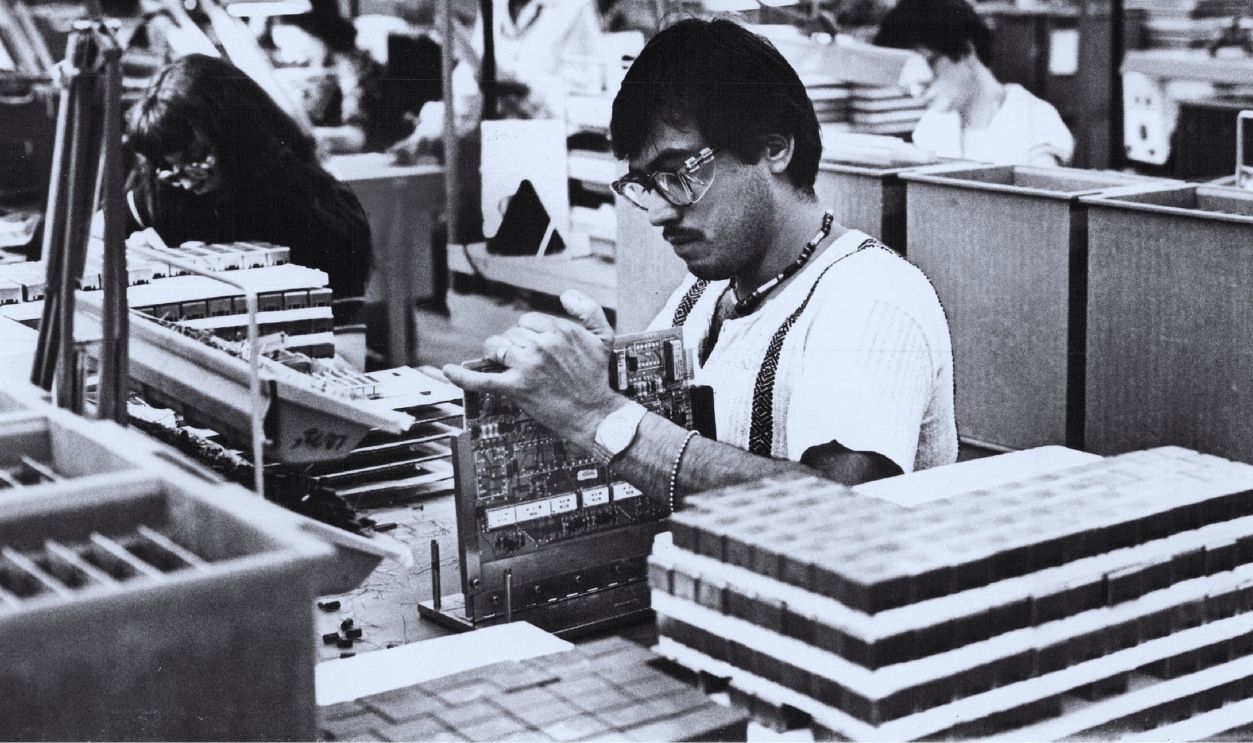 Gettyimages - 837315568, Denver Post Archives MAR 17 1981, MAR 19 1981 Western Electric Westminister Plant Booming Among 5,700 Colorado employees is Leroy Damian, who inserts components on circuit packs at Western Electric plant. Products produced include Dimension private branch exchange (PBX), Horizon system for small offices and new hospital communications management system. Combined payroll in state totals more than $216 million.