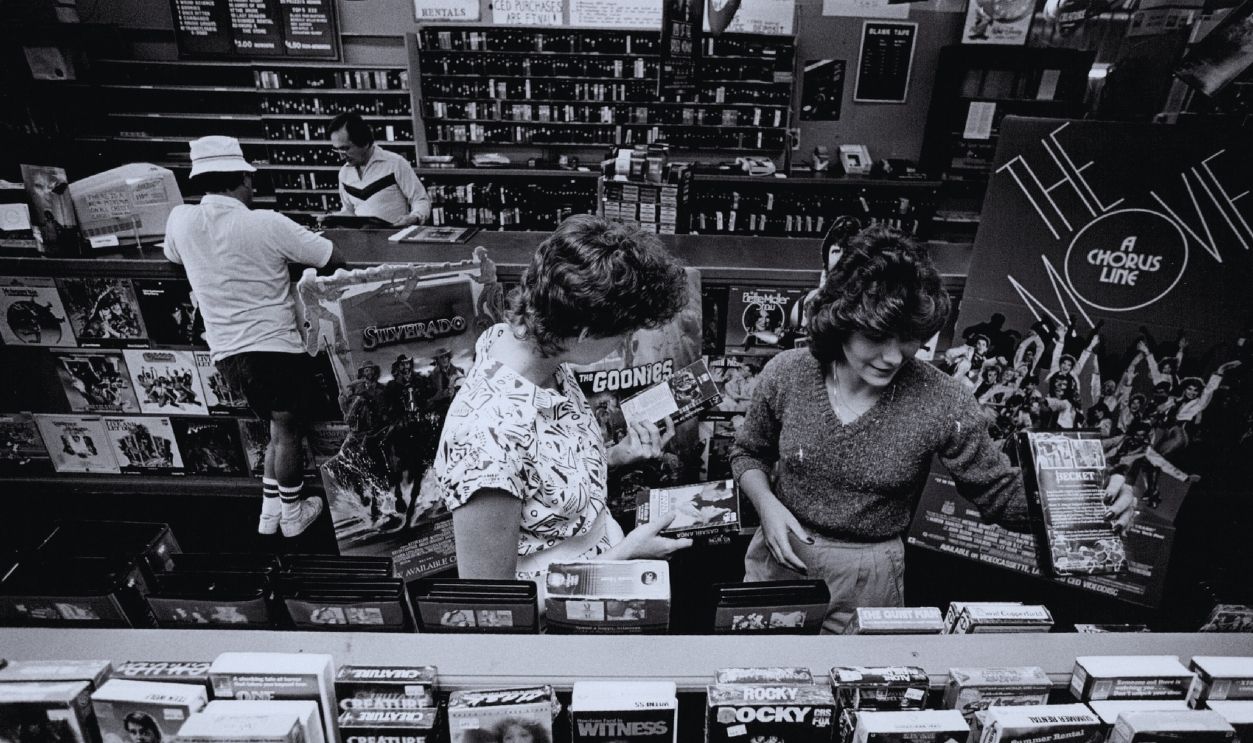 Gettyimages - 161883474, MAY 18 1986; Employees, Tammy Swier and Candy Pineda look at the VCR cassette tapes at Colfax Video, MAY 18 1986; Employees, Tammy Swier and Candy Pineda look at the VCR cassette tapes at Colfax Video, 5158 East Colfax (388-5763).;