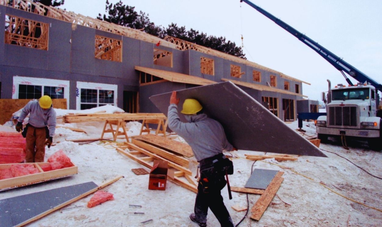 Gettyimages - 1154146236, GENERAL INFORMATION: Woodbury, Mn., Thurs., Jan. 4, 2001--A development under construction that contains public housing units within a market rate complex. IN THIS PHOTO: Bill Henneberg (l.) and Carl Monn, employees of Doug Speedling Builders applied ins