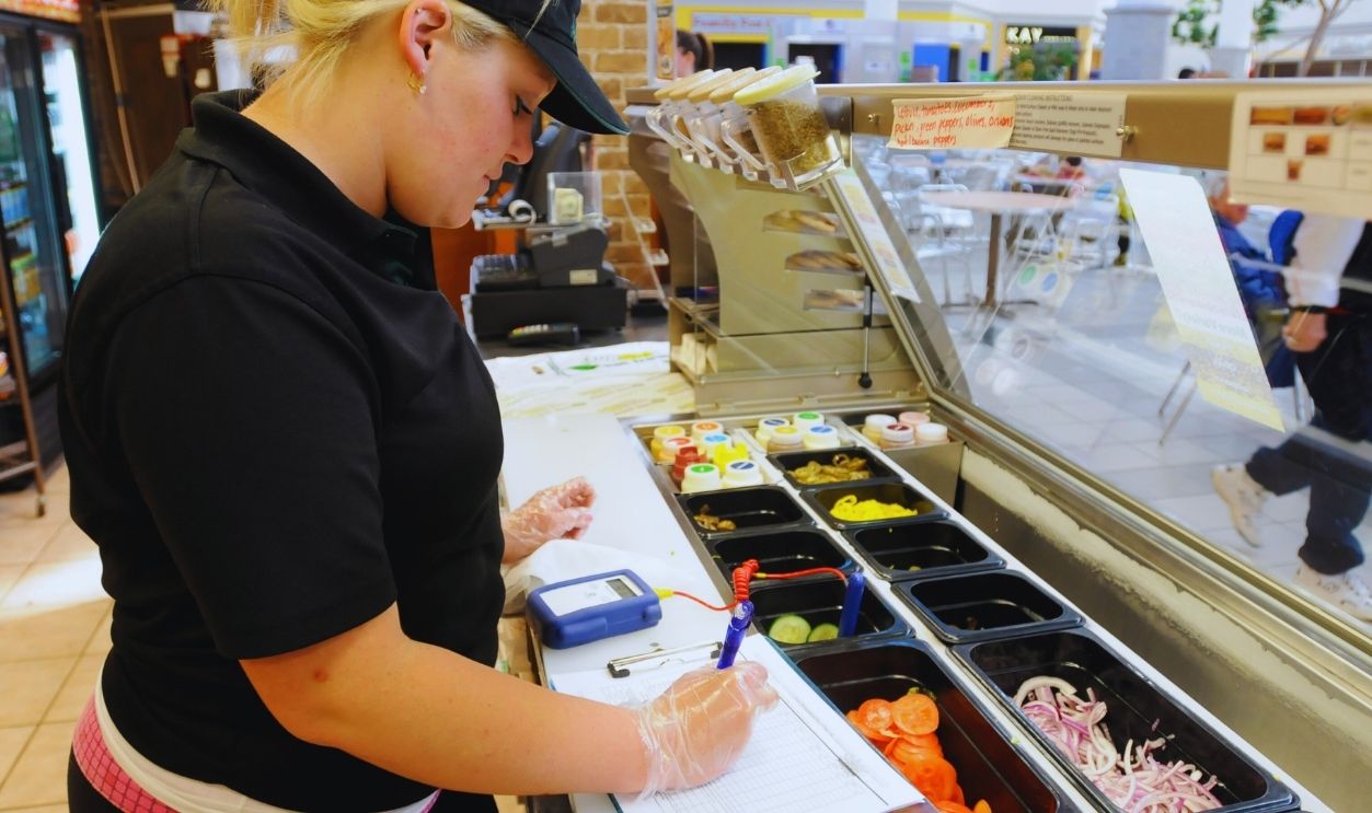Gettyimages - 1315491598, Subway employee Erin Gaffney uses a digital thermometer while taking notes of the readouts.Food safety is taken seriously at Subway restaurants, including daily checks of the temperature of ingredients and cooler space.