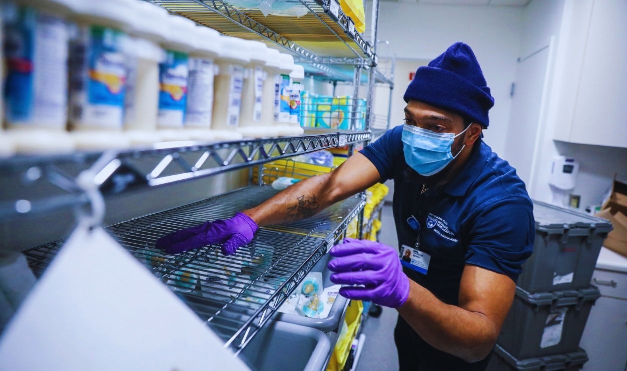 Gettyimages - 1238503256, Hiring Crisis At Hospitals Boston, MA - February 8: An employee who works in Materials Management at Brigham and Womens Hospital, stocks medical supplies while working at the hospital on in Boston on Feb. 8, 2022. Welcomed to the staff during a hiring crisis, he has been working at Brigham and Womens Hospital for four months.