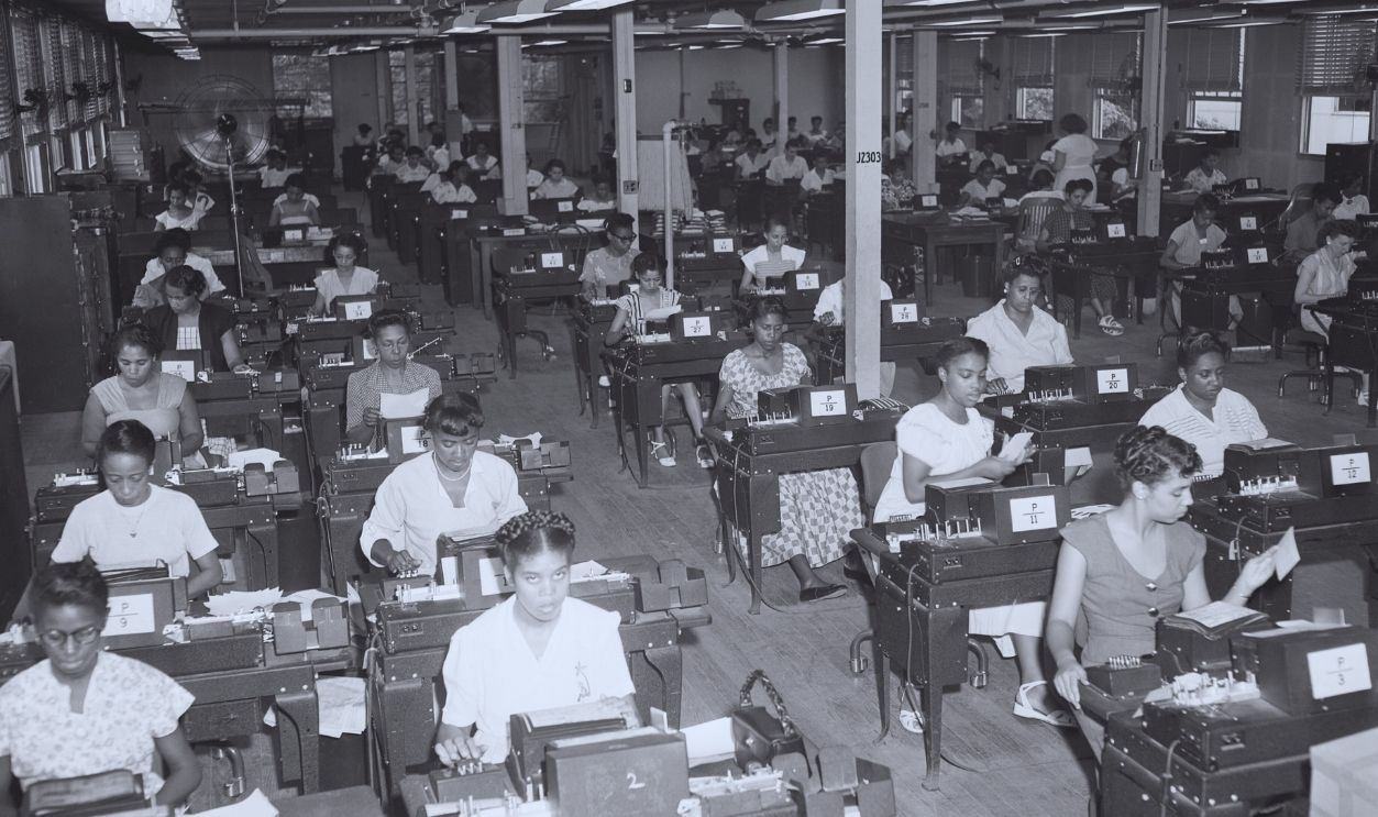 Gettyimages - 514866910, Workers In Large Room Typing,Making Card (Original Caption) 8/29/1949-Washington, D.C., Veterans Administration. National Service Life Insurance to be paid to some 16,000,000 present and former policy holders. Hundreds of employees work staggered shifts to produce and process millions of punched cards from which later will be computed the amount of dividend to which each veteran is entitled. This special dividend will amount to $2,800,000,000.