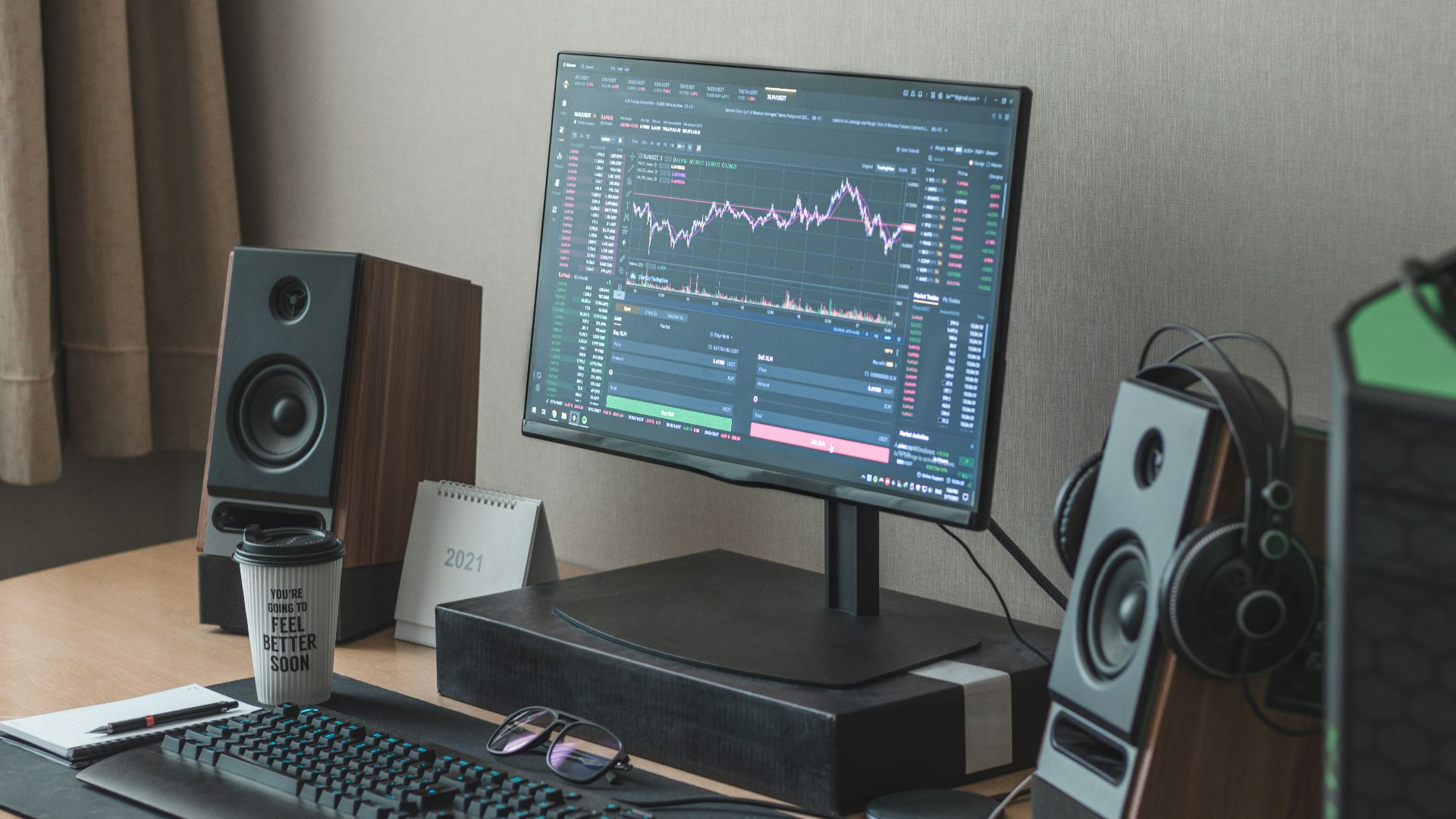 black flat screen computer monitor turned on beside black computer keyboard
