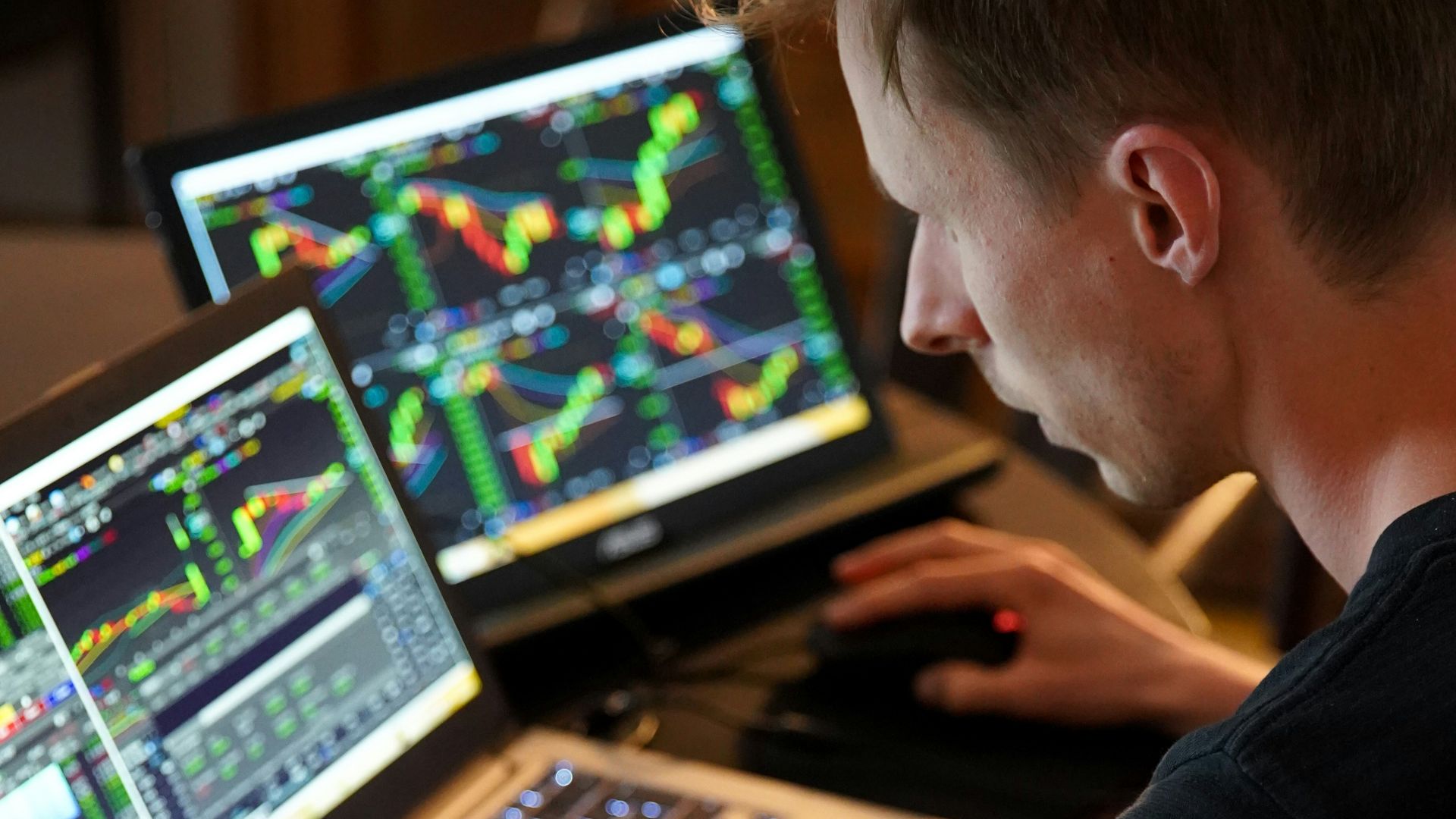 man sitting in front of the laptop