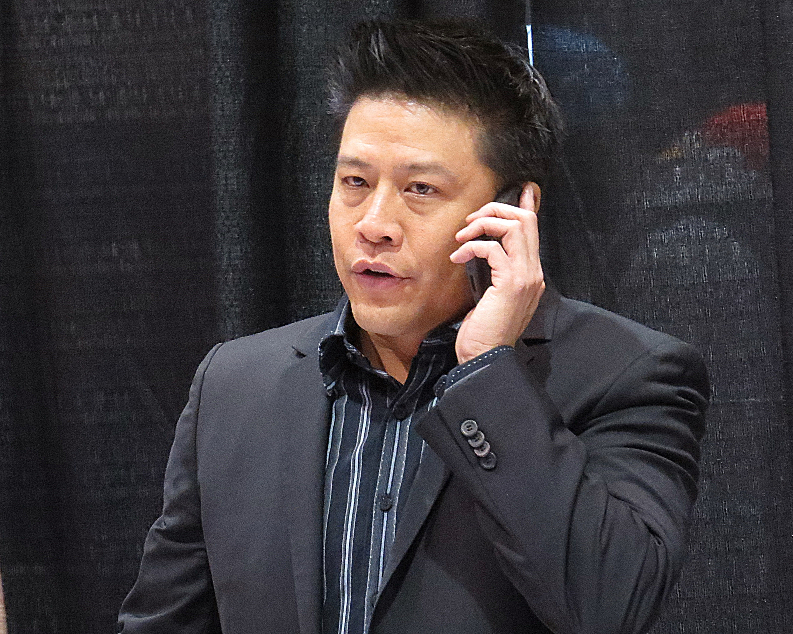 File:Garrett Wang on the phone (13932402030).jpg