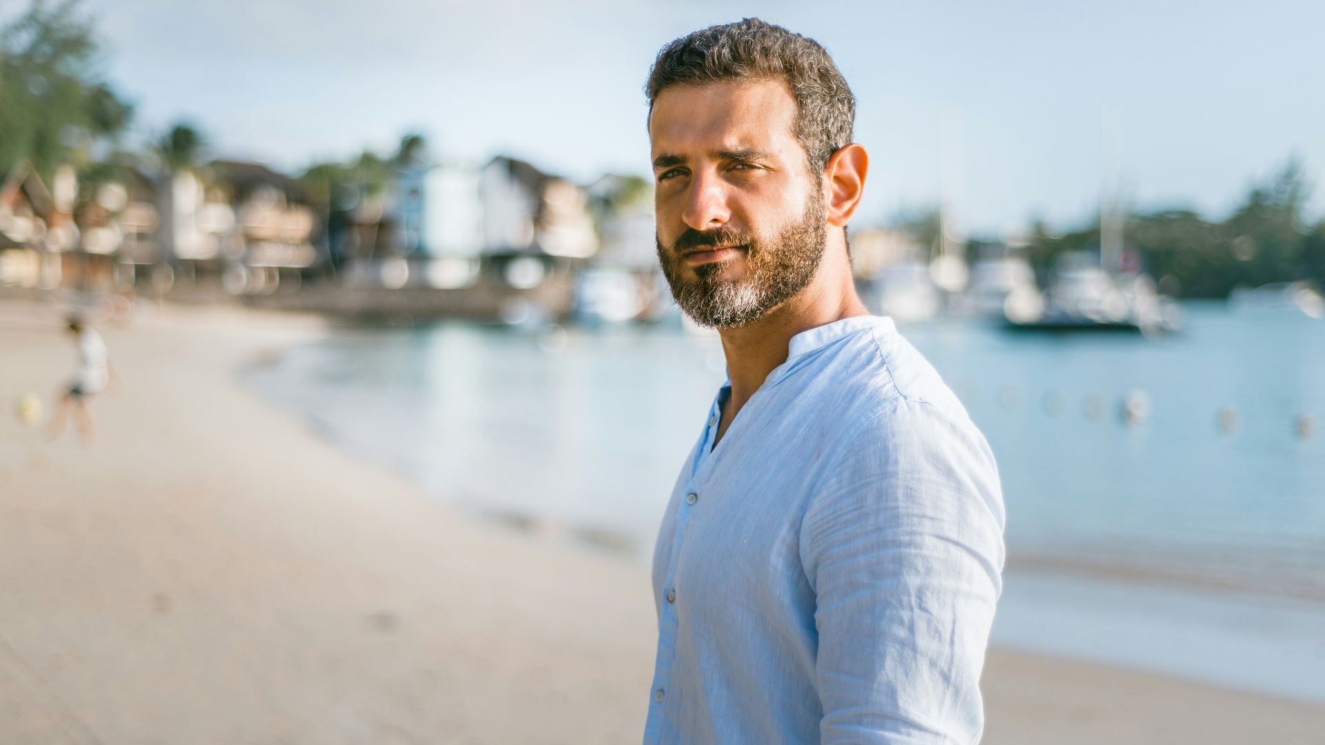man standing on beach during daytime