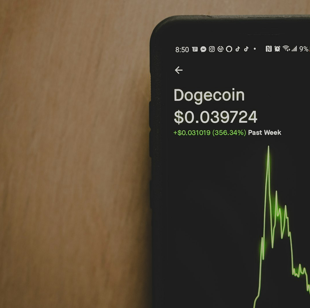 black iphone on brown wooden table