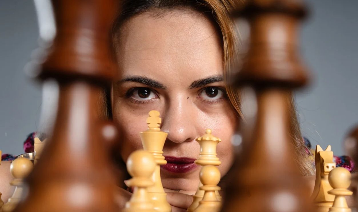 A lady playing chess