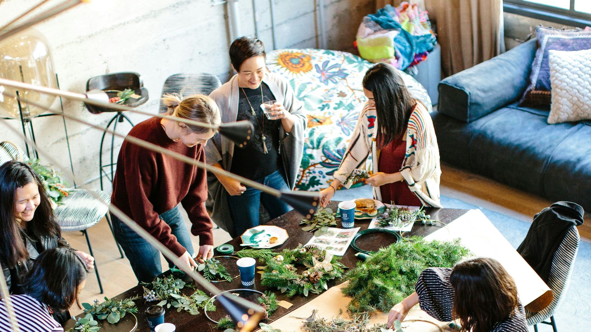woman sitting on chair holding leaf