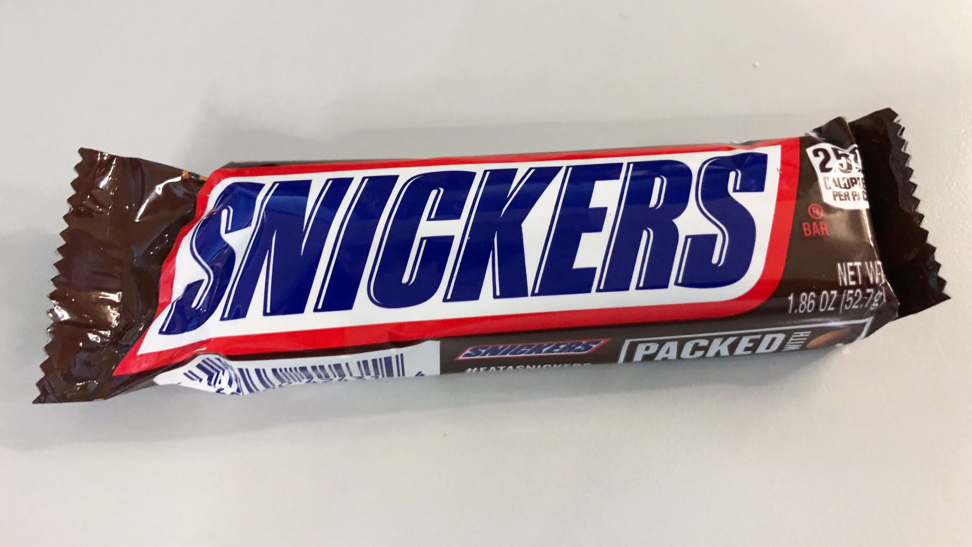 File:2019-01-28 19 55 14 A Snickers bar with the wrapper still intact in the Dulles section of Sterling, Loudoun County, Virginia.jpg