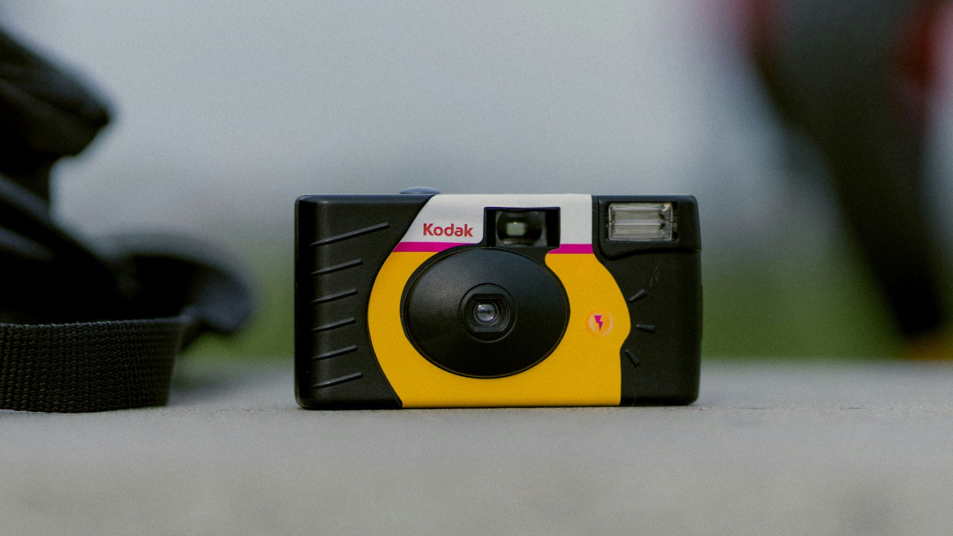 selective focus photograph of black and yellow Kodak camera