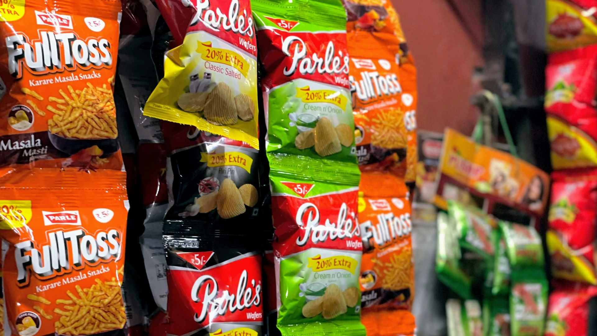 a bunch of bags of food are stacked on top of each other