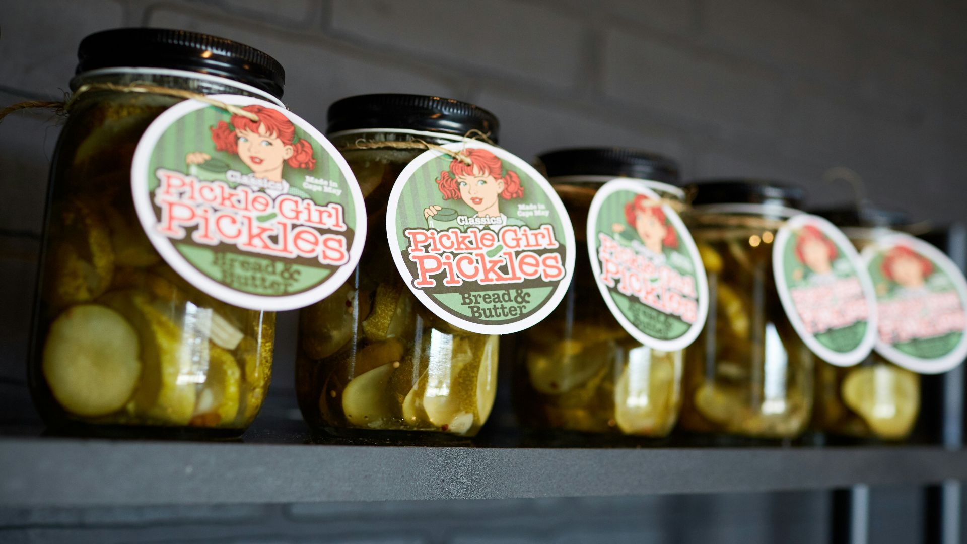 clear glass bottle on black table