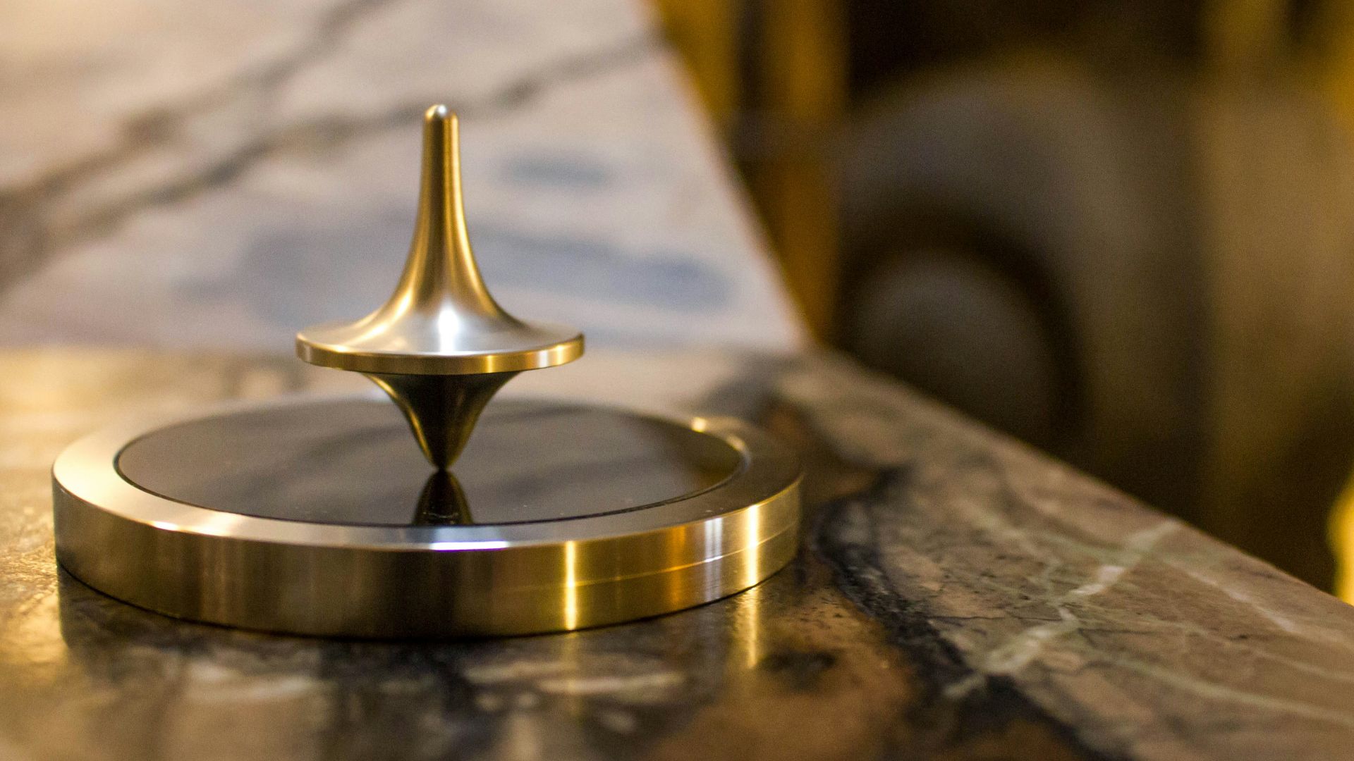 close photo of round gray and black metal tool