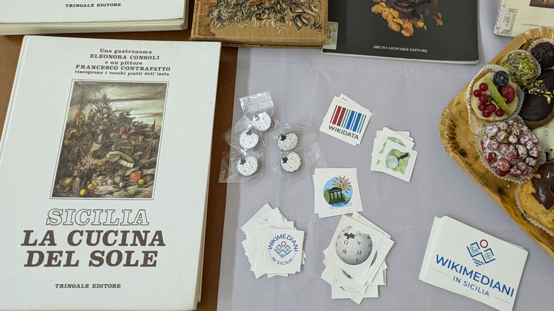 File:Start of Wiki Loves Sicilia 2024 in Catania, book, stickers and sweets.jpg
