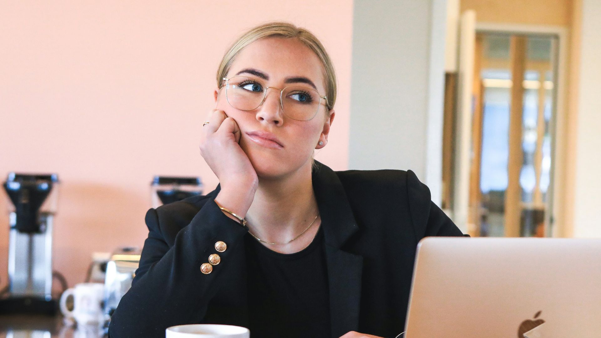 woman in black long sleeve shirt using macbook