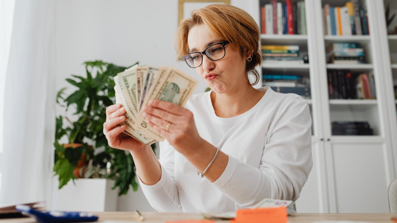 Woman Counting the Money