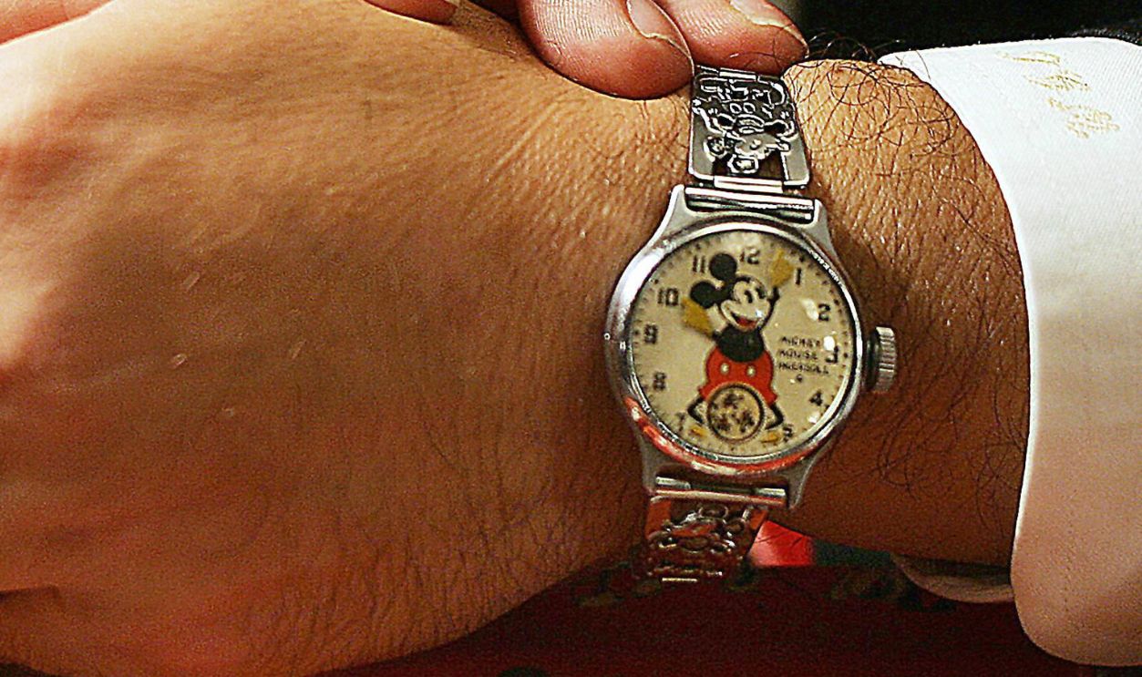 homas Milani of the US shows a Mickey Mouse-designed watch for sale at the Antique and Modern Watch Jewelry Show at a hotel in Hong Kong, 26 August 2005. The rare Mickey Mouse watch, priced at 38,000 HK dollars (4,800 USD), was originally made in the US in 1933 and is one of a 20-piece Disney characters watch set worth over 100,000 HK dollars (12,800 USD).
