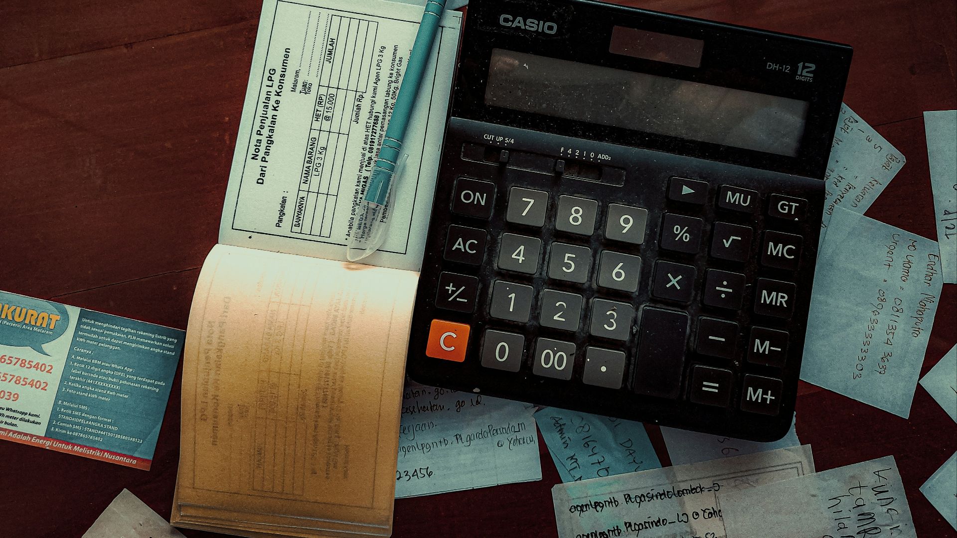 a calculator sitting on top of a wooden table