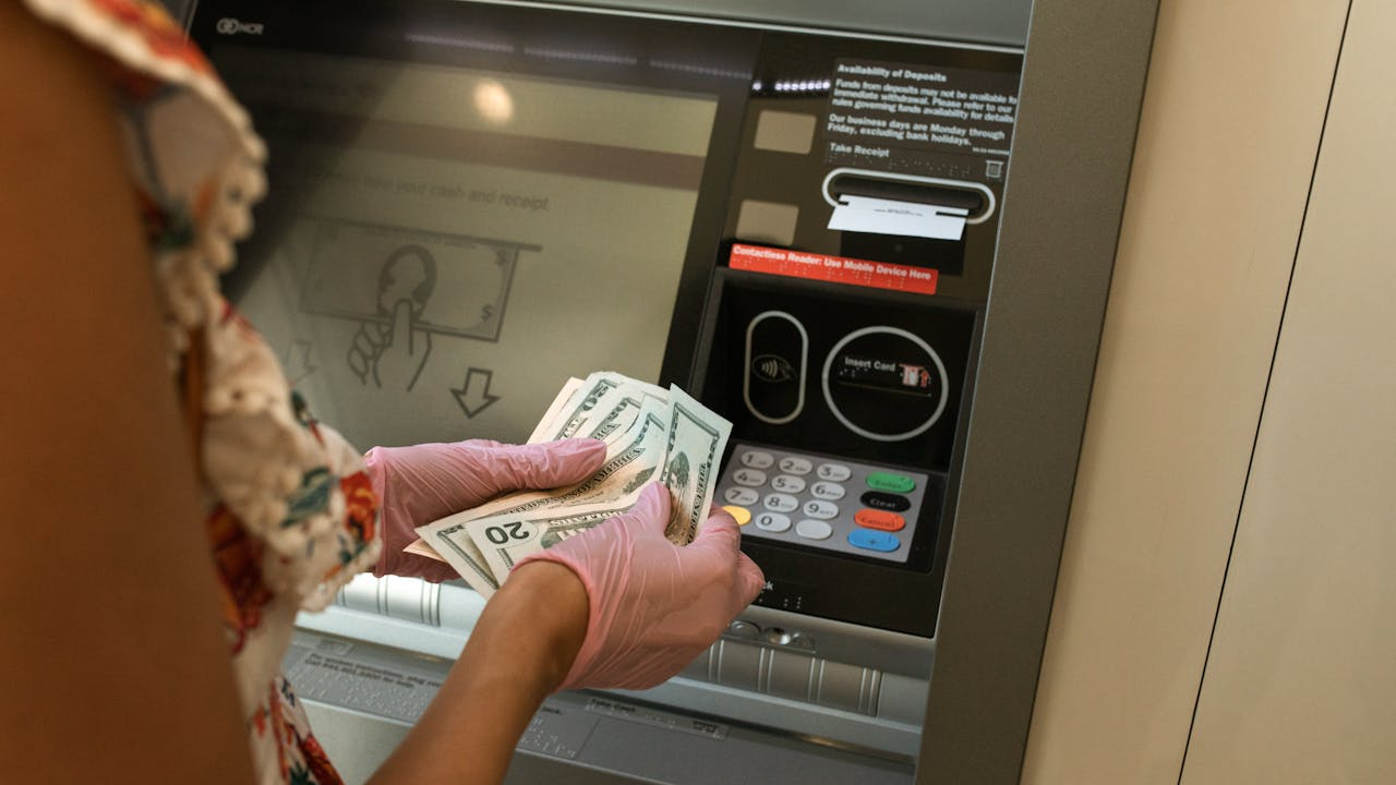 Woman using ATM