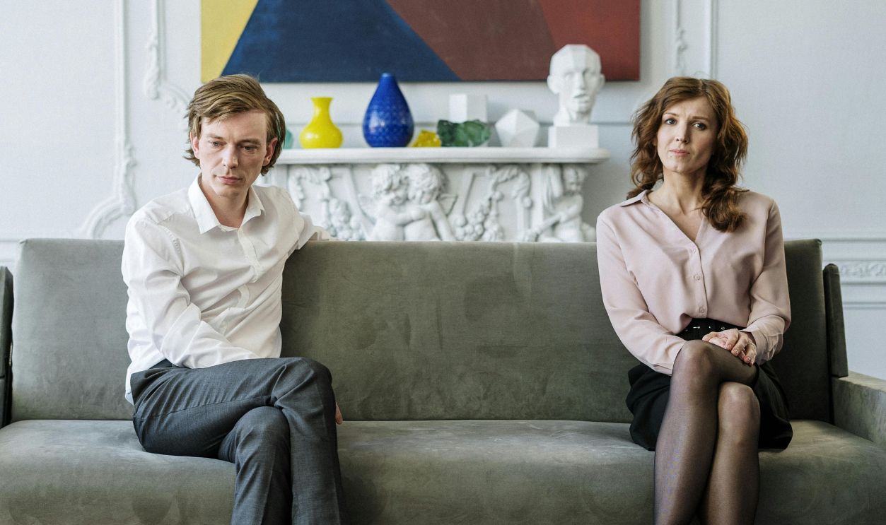 Woman in white dress shirt and black pants