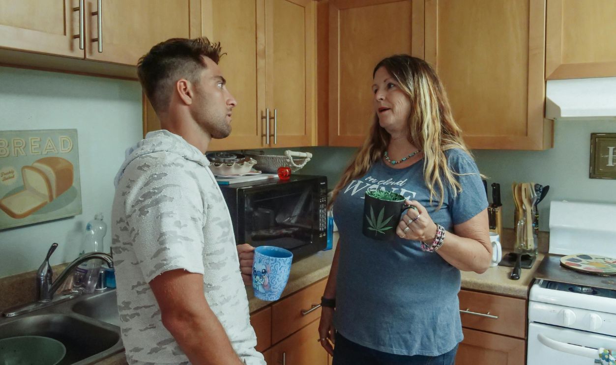Mother and son having coffee