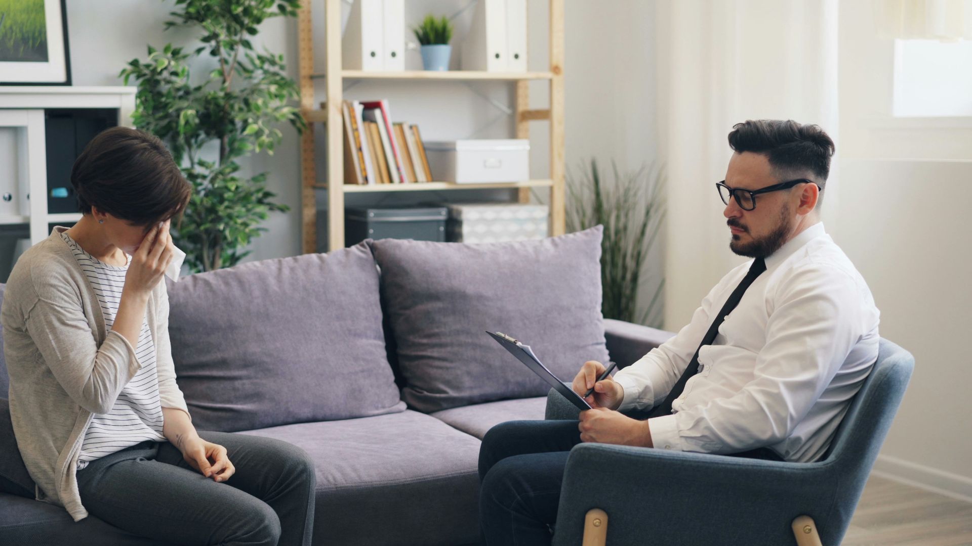 a man and a woman sitting on a couch