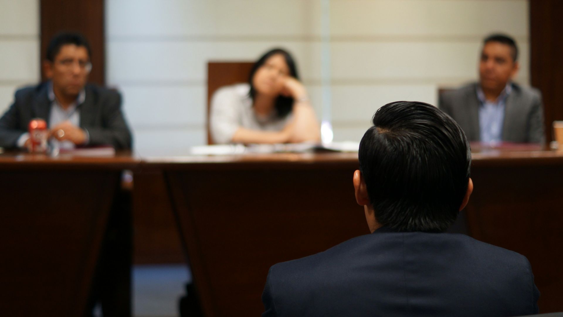 man in black shirt sitting beside woman in white shirt