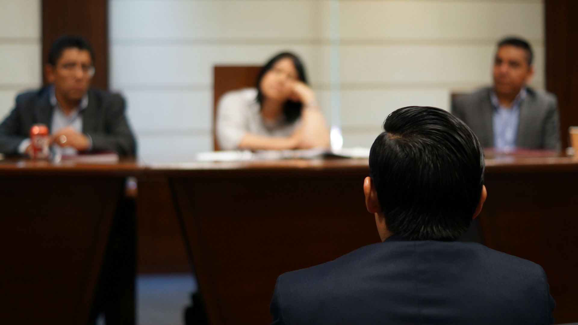 man in black shirt sitting beside woman in white shirt