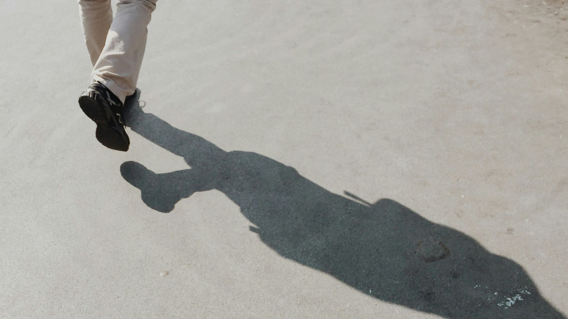 shadow of person on gray surface
