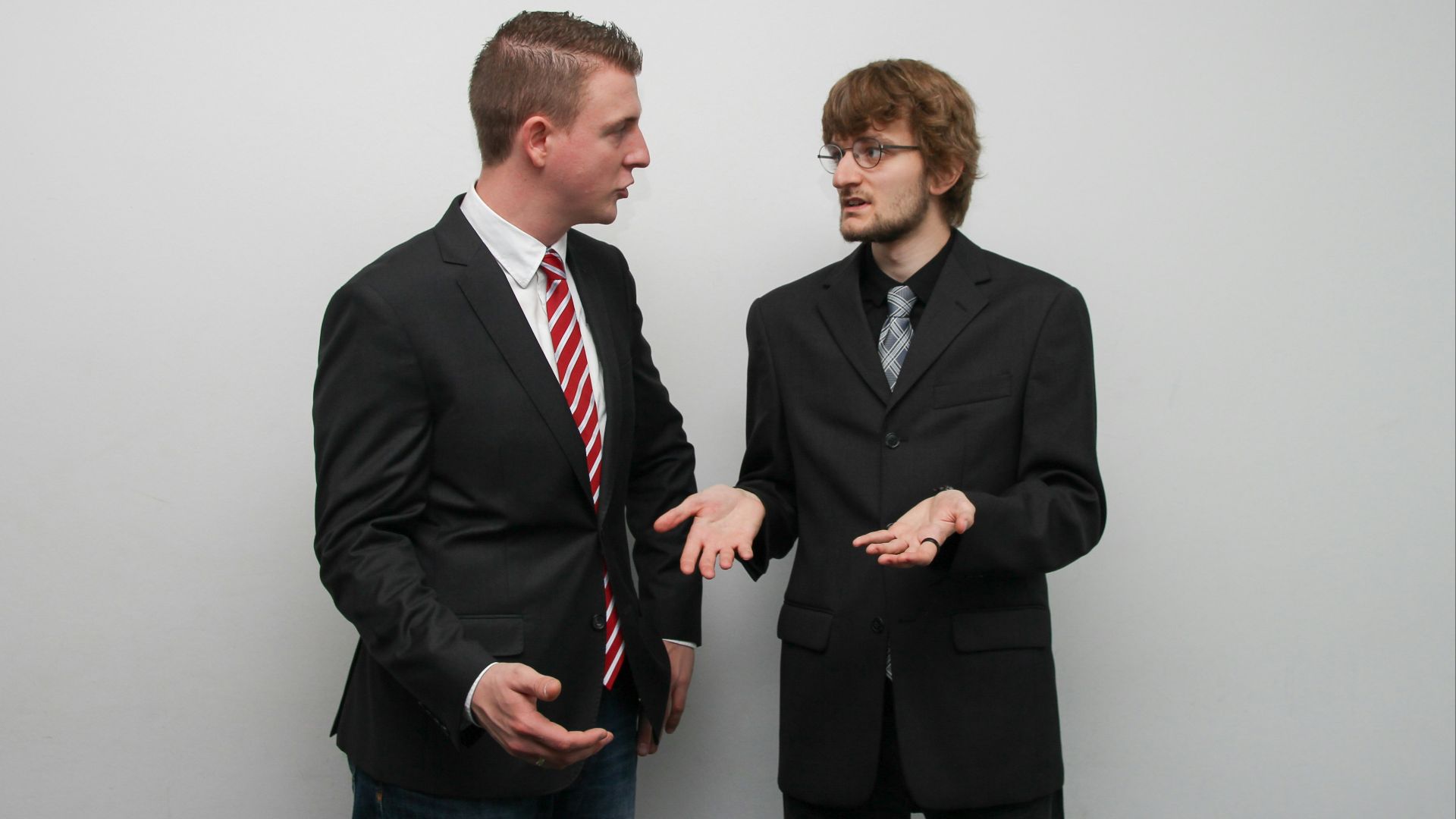 man wearing black suit jacket