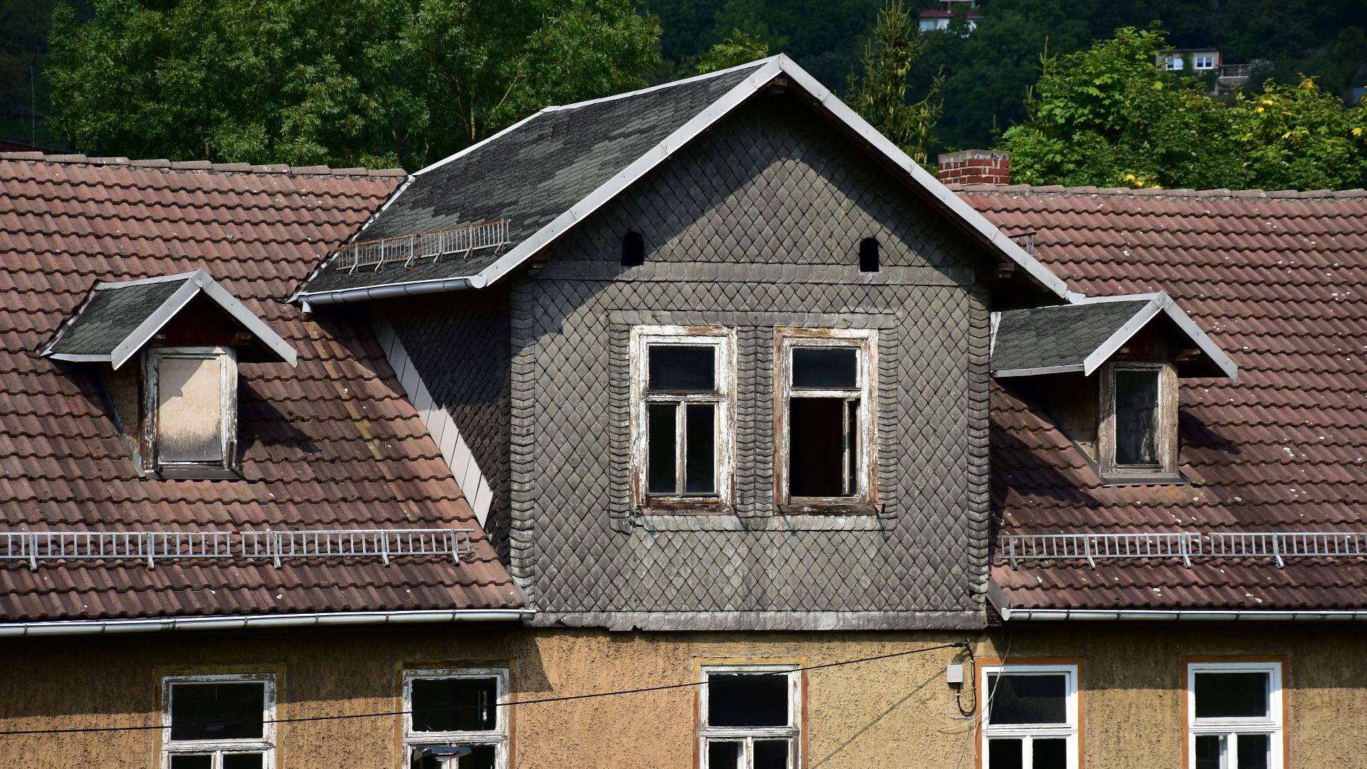 a house with a clock on the front of it