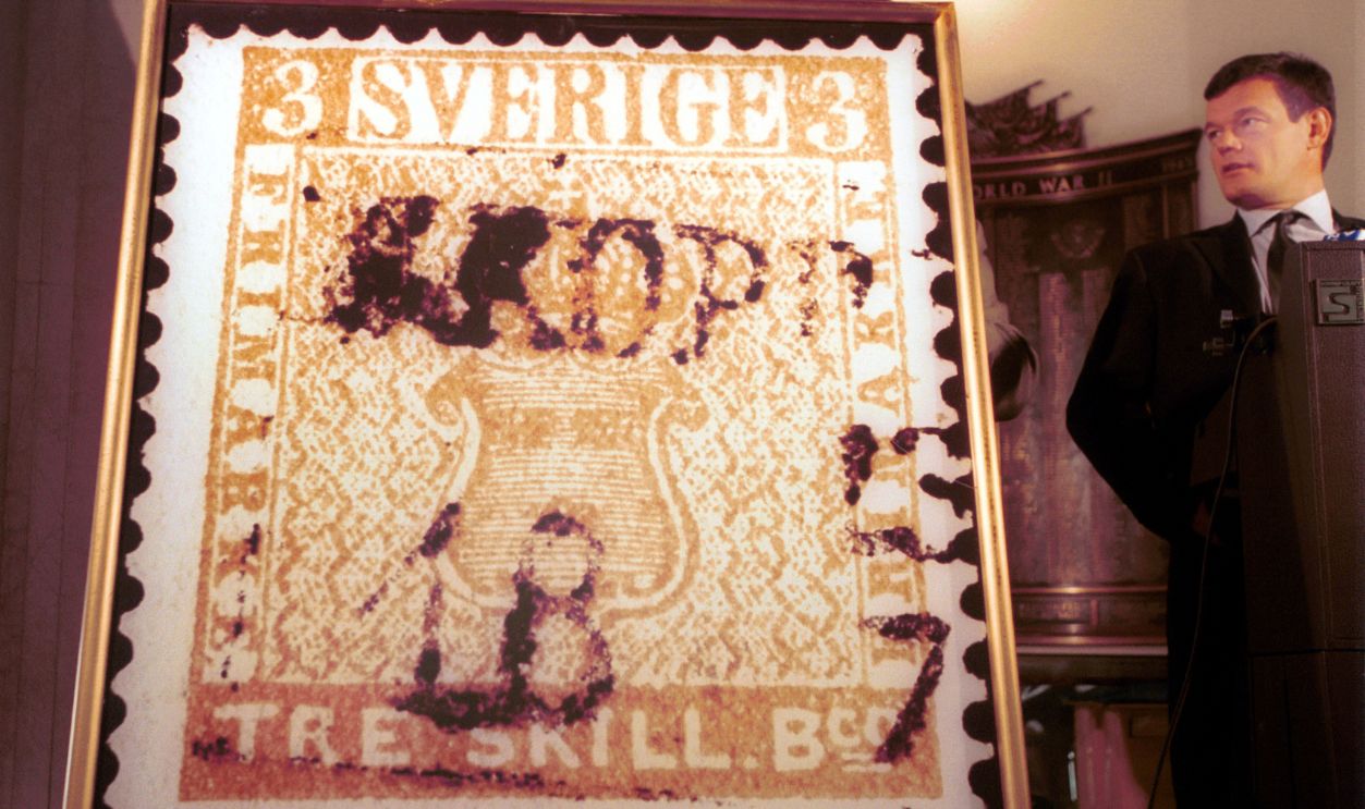  Thomas Hoiland, a Danish stamp auctioneer, looks at a reproduction of the world's most valuable postage stamp, the 3 Skilling Yellow, January 11, 2001 in New York City. The Swedish stamp was printed in error in the incorrect color in 1857, and was sold to a collector in 1998 for $2.3 million