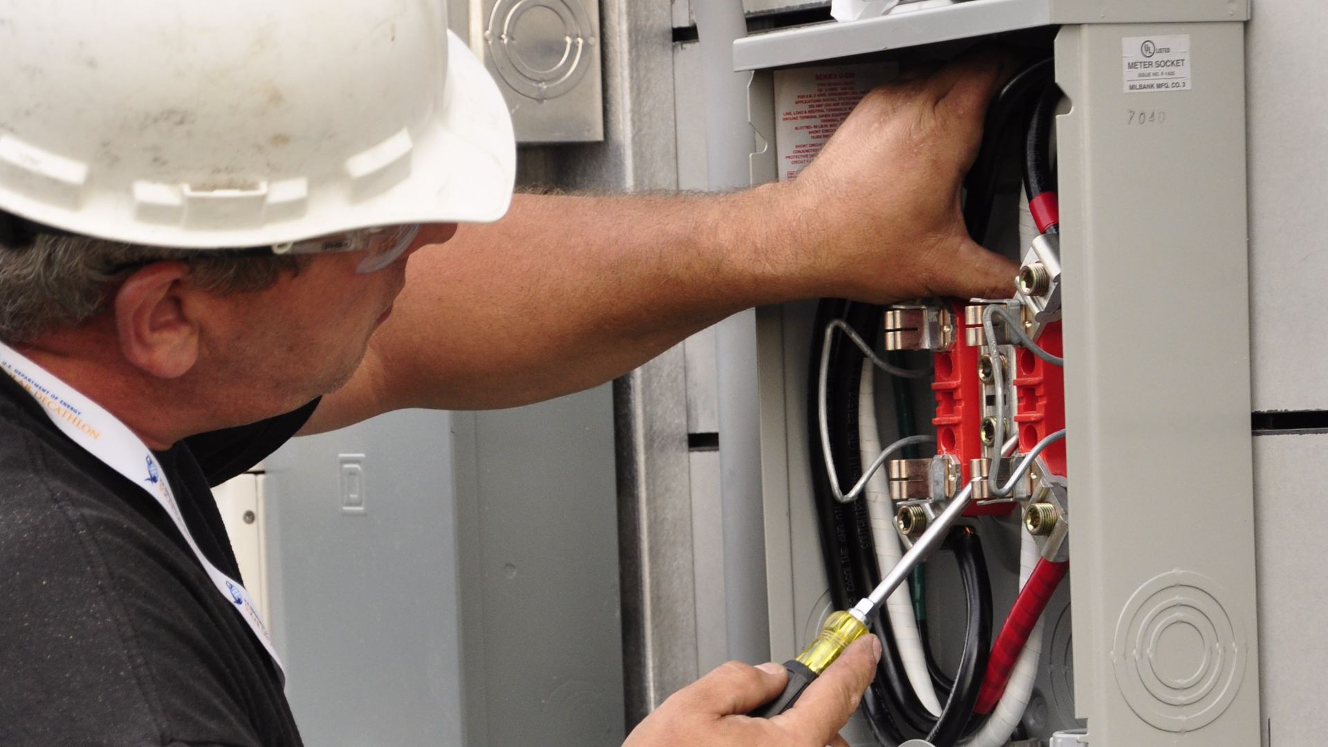 File:Electrician Mike Hughes Installing Meter Base.jpg
