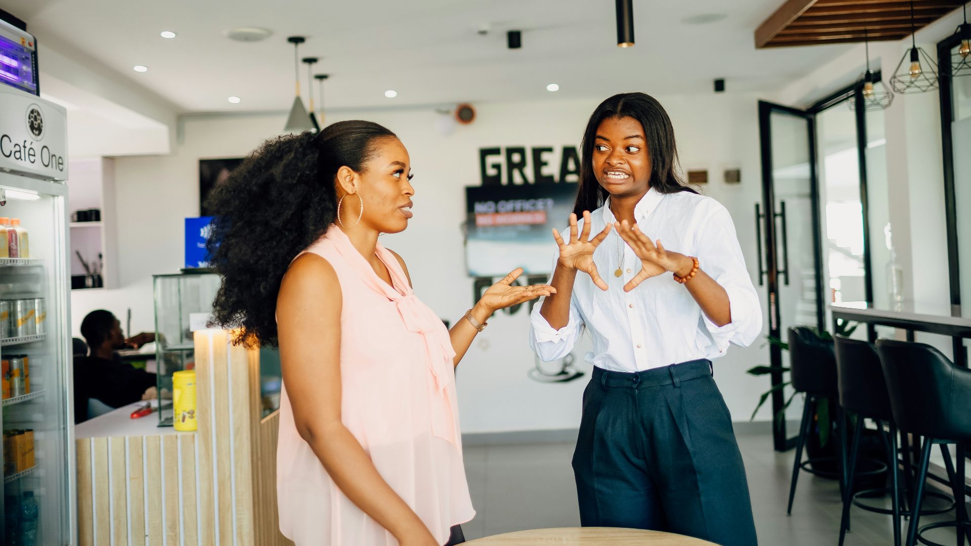 A couple of women standing next to each other