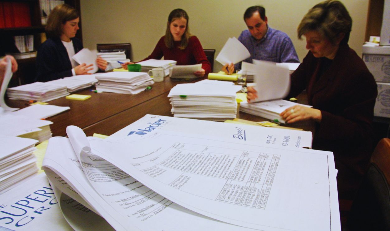 Gettyimages - 691096, House Committee Inspects Enron Documents 399670 01: Investigators for the U.S. House Energy and Commerce Committee exam Enron documents January 15, 2002 on Capitol Hill in Washington, DC. Fired Arthur Andersen LLP auditor David Duncan will meet with congressional investigators January 16, 2002 for his alleged role in destroying Enron documents.