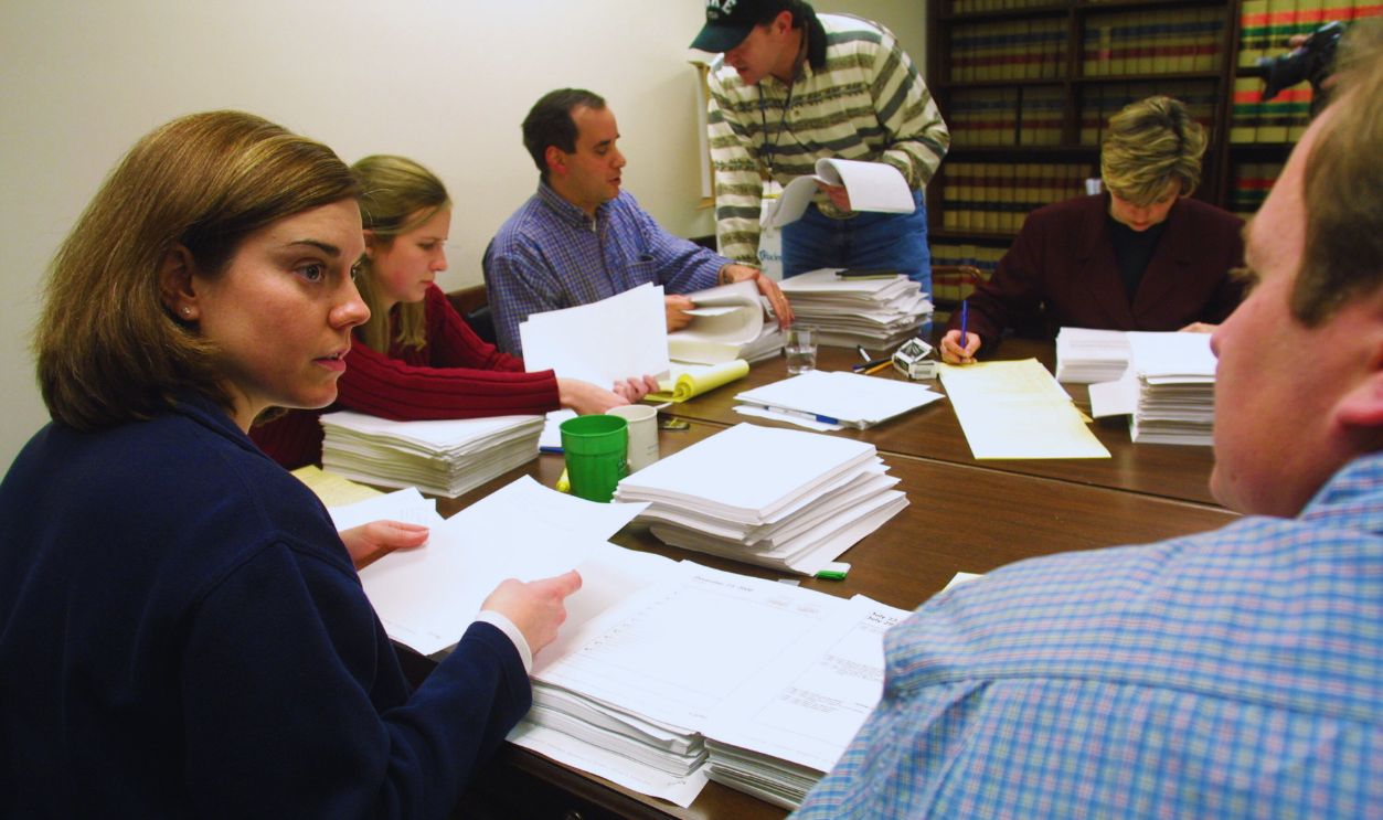 Gettyimages - 754527, House Committee Inspects Enron Documents 399670 03: Investigators for the U.S. House Energy and Commerce Committee exam Enron documents January 15, 2002 on Capitol Hill in Washington, DC. Fired Arthur Andersen LLP auditor David Duncan will meet with congressional investigators January 16, 2002 for his alleged role in destroying Enron documents.