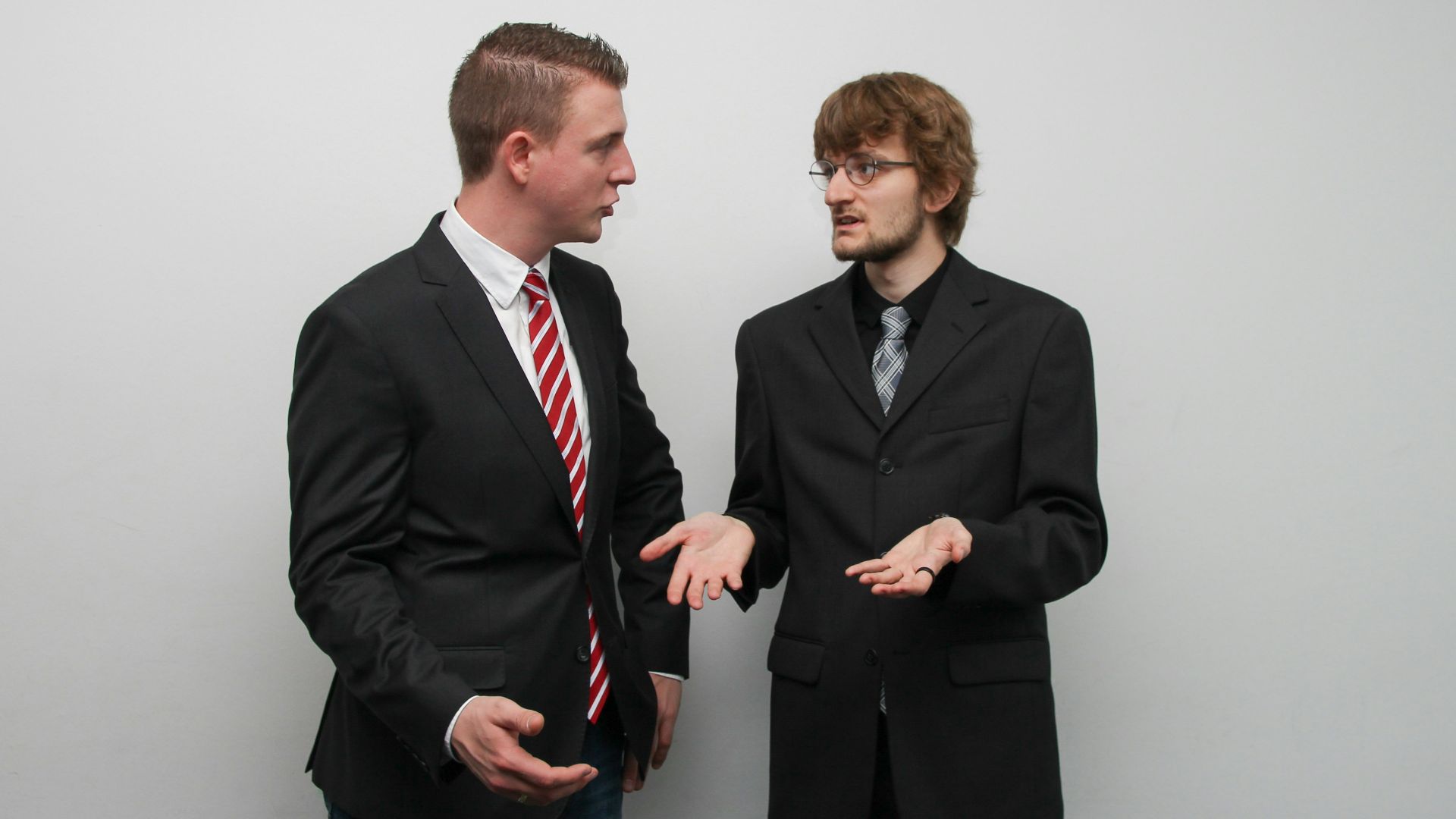 man wearing black suit jacket